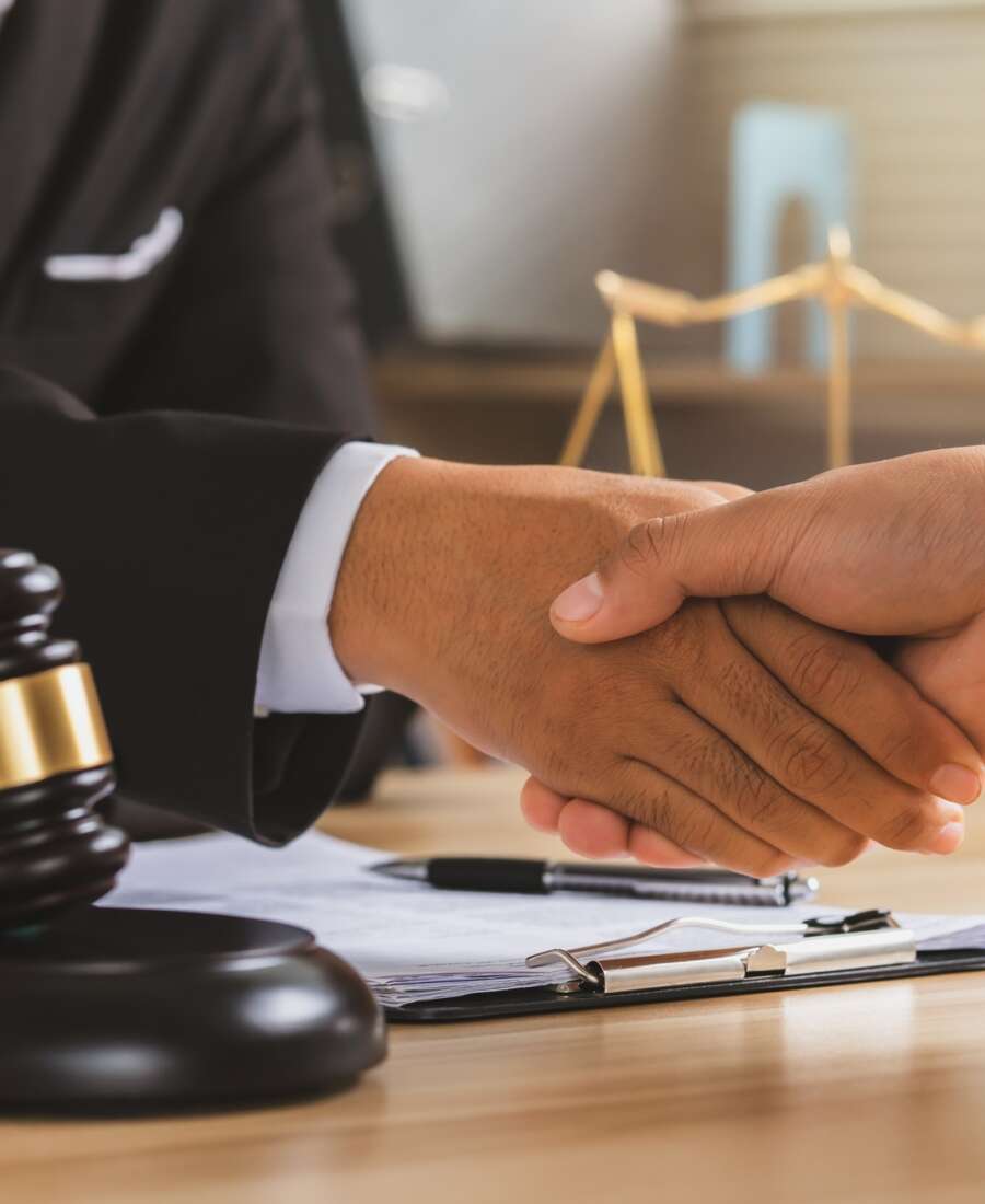 justice and law concept.Legal law, advice and justice, Businessman handshake with a lawyer.